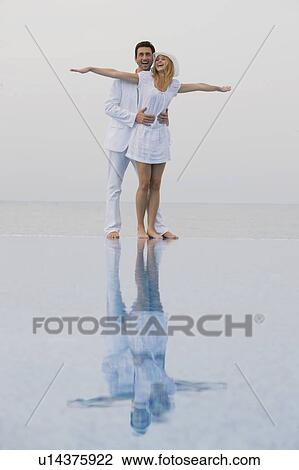 Stock Image - Couple in white. Fotosearch