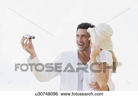Stock Photograph - Couple in white. Fotosearch