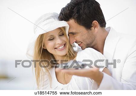 Couple in white View Large Photo Image Stock Photography - Couple in white. Fotosearch