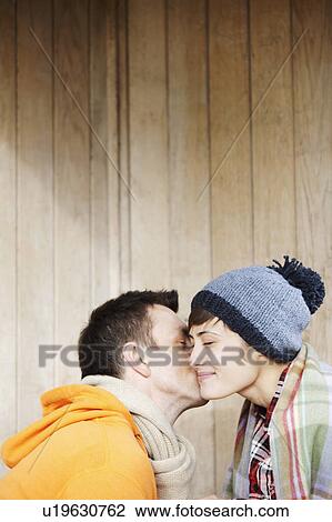 Couple kissing in a hut in the park View Large Photo Image Stock Image - Couple kissing in a hut in the park. Fotosearch