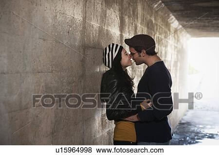 Couple kissing in tunnel View Large Photo Image Stock Photo - Couple kissing in tunnel. Fotosearch