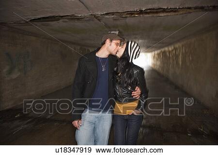 Couple kissing in tunnel View Large Photo Image Stock Photo - Couple kissing in tunnel. Fotosearch