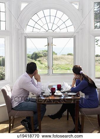 Couple looking out of the window View Large Photo Image Stock Image - Couple looking out of the window. Fotosearch