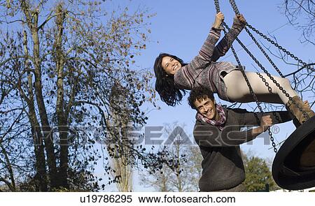 Couple on swing View Large Photo Image Stock Photography - Couple on swing. Fotosearch