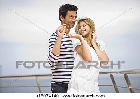 Stock Image - Couple on yacht. Fotosearch