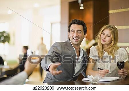 Couple sitting at bar View Large Photo Image Stock Photo - Couple sitting at bar. Fotosearch