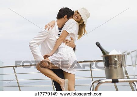 Couple standing at railing View Large Photo Image Stock Photo - Couple standing at railing. Fotosearch