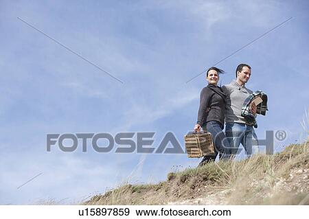 Couple taking a stroll View Large Photo Image Stock Photo - Couple taking a stroll. Fotosearch