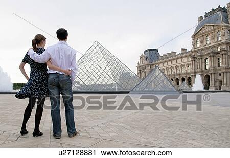 Couple view the Louvre paris View Large Photo Image Stock Image - Couple view the Louvre paris. Fotosearch