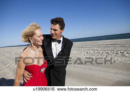 Couple walking on beach View Large Photo Image Stock Photograph - Couple walking on beach. Fotosearch