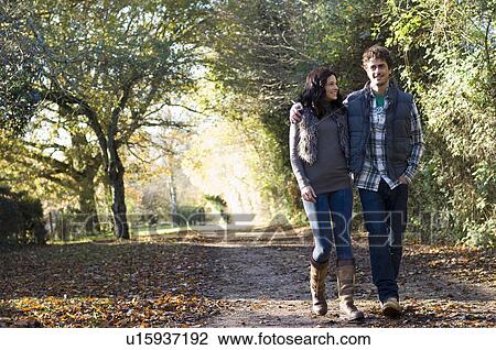 Couple walking together View Large Photo Image Stock Image - Couple walking together. Fotosearch