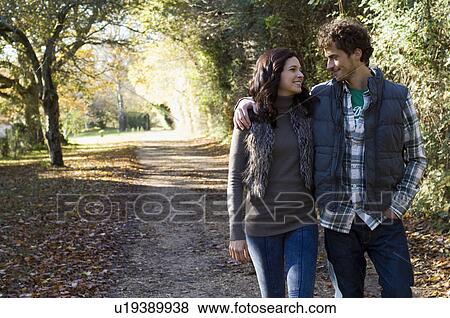 Stock Photo - Couple walking together. Fotosearch
