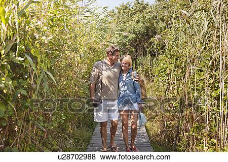 Stock Photo - Couple walking together. Fotosearch