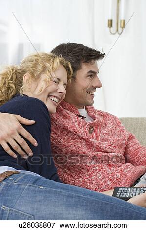 Couple watching tv View Large Photo Image Stock Photo - Couple watching tv. Fotosearch