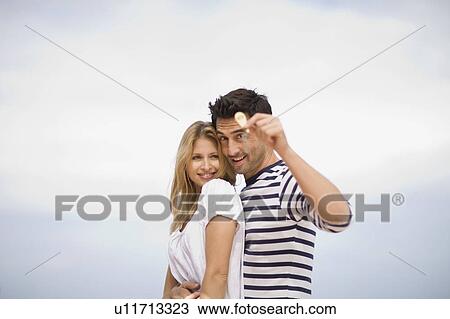 Couple with key View Large Photo Image Stock Image - Couple with key. Fotosearch