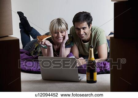 Stock Image - Couples first night in new apartment. Fotosearch