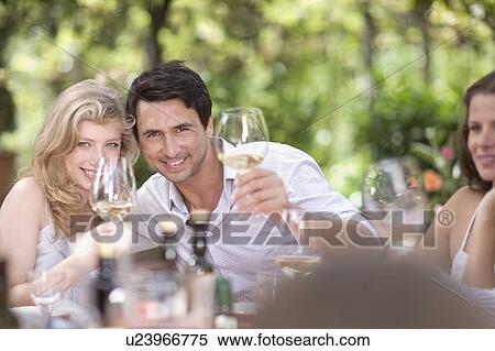 Crowd clinking glasses View Large Photo Image Stock Photography - Crowd clinking glasses. Fotosearch