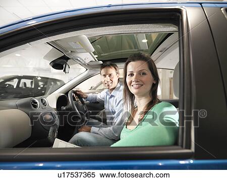 Customers inside car in car dealership View Large Photo Image Stock Photography - Customers inside car in car dealership. Fotosearch