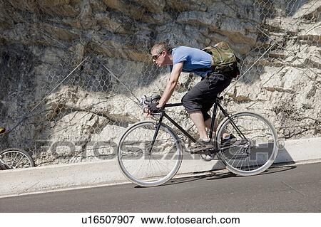 Cyclist on mountain road View Large Photo Image Stock Photo - Cyclist on mountain road. Fotosearch
