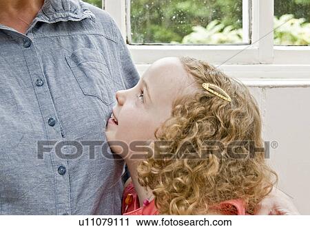 Daughter looking up to Mum View Large Photo Image Stock Image - Daughter looking up to Mum. Fotosearch