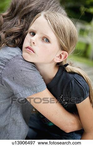 Stock Photo - Daughter looking upset. Fotosearch
