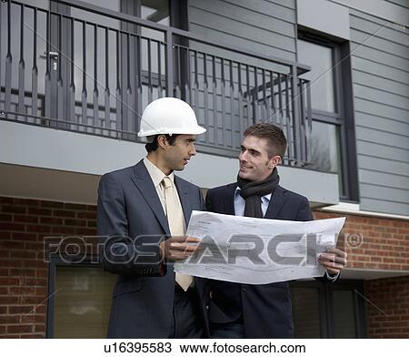 Developer talking to architect View Large Photo Image Stock Image - Developer talking to architect. Fotosearch