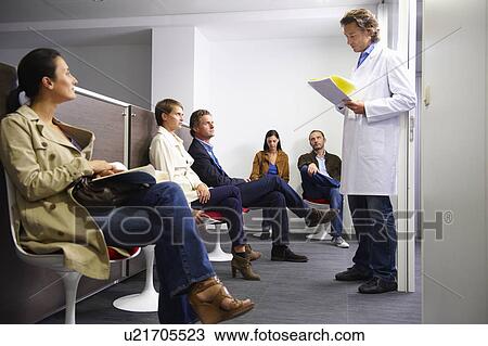 Doctor calling a patient in waiting room View Large Photo Image Stock Image - Doctor calling a patient in waiting room. Fotosearch