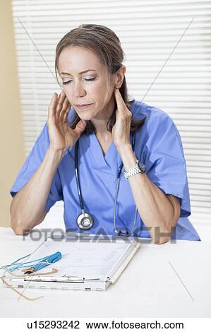 Stock Image - Doctor in office. Fotosearch