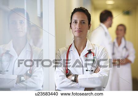 Stock Image - Doctor looking at camera. Fotosearch