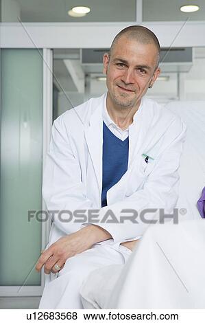 Stock Photo - Doctor sittingon patients couch. Fotosearch