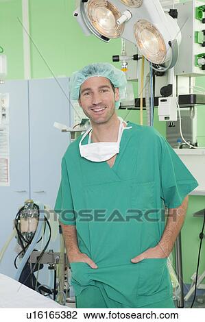 Doctor with scrub, smiling View Large Photo Image Stock Image - Doctor with scrub, smiling. Fotosearch