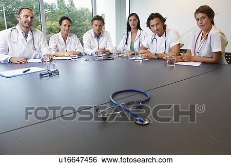 Stock Photograph - Doctors in conference room. Fotosearch