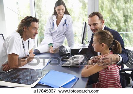 Doctors with patients, in office View Large Photo Image Stock Photo - Doctors with patients, in office. Fotosearch