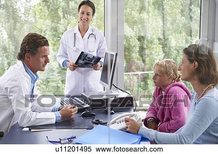 Doctors with patients, in office View Large Photo Image Stock Photography - Doctors with patients, in office. Fotosearch