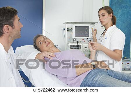EKG monitoring with nurse and doctor View Large Photo Image Stock Image - EKG monitoring with nurse and doctor. Fotosearch