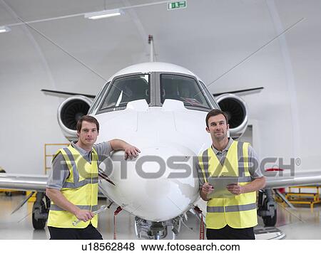 Stock Photo - Engineers with jet aircraft. Fotosearch