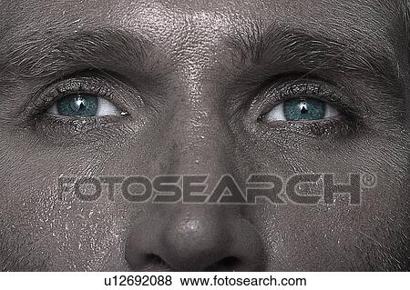 Stock Photo - Eyes of a sweating man. Fotosearch