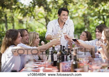 Picture - Family at the table. Fotosearch