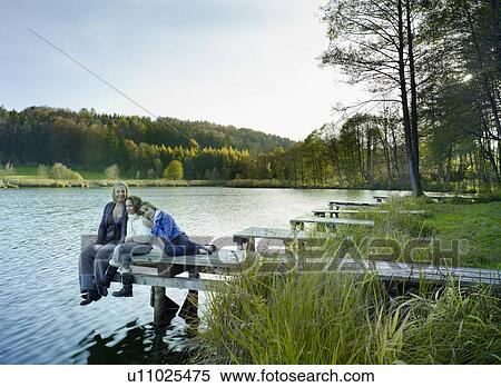 Stock Photography - Family enjoying autumnal atmosphere. Fotosearch