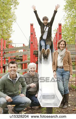 Family having fun at the park View Large Photo Image Picture - Family having fun at the park. Fotosearch