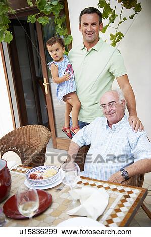 Stock Photo - Family having lunch. Fotosearch