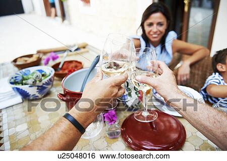 Family having lunch View Large Photo Image Stock Photograph - Family having lunch. Fotosearch
