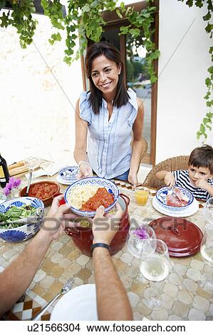 Picture - Family having lunch together. Fotosearch