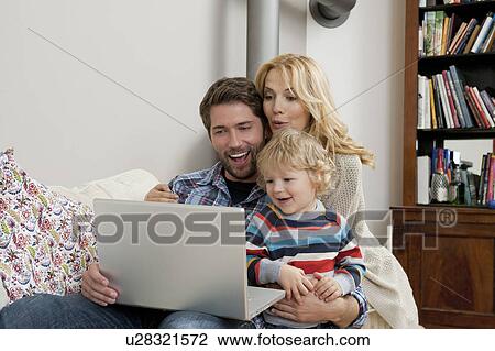 Family in front of computer View Large Photo Image Stock Image - Family in front of computer. Fotosearch