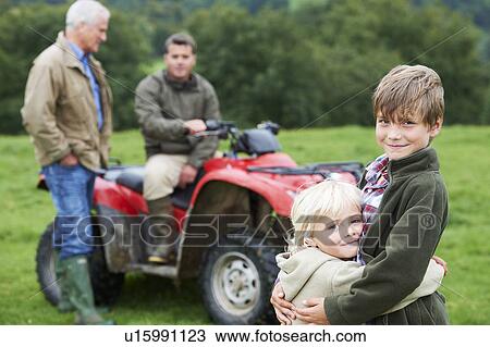 Family on quad bike View Large Photo Image Stock Image - Family on quad bike. Fotosearch