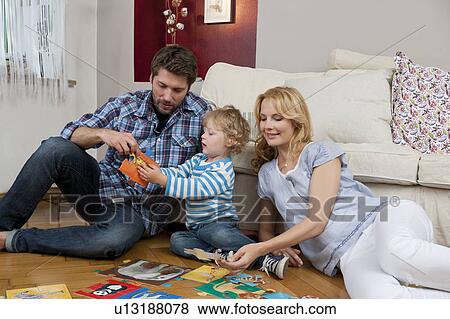 Family playing on floor View Large Photo Image Stock Photo - Family playing on floor. Fotosearch