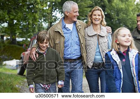 Family walking on farm View Large Photo Image Stock Image - Family walking on farm. Fotosearch