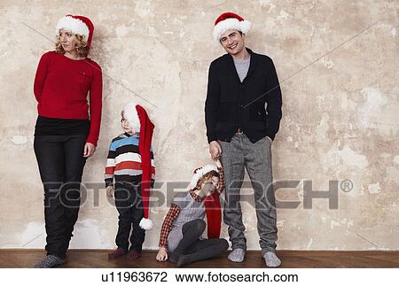 Family with Santa hats View Large Photo Image Stock Image - Family with Santa hats. Fotosearch