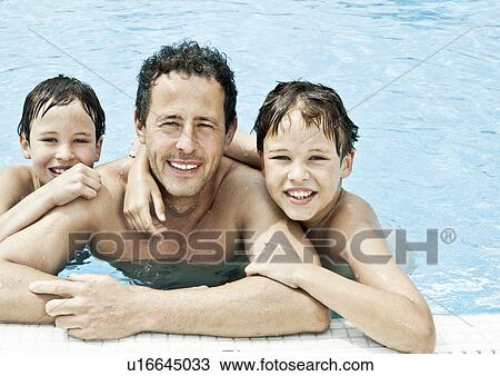 Stock Image - Father and 2 sons pool portrait. Fotosearch