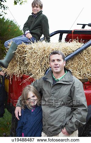 Stock Photo - Father and children with 4x4 landrover. Fotosearch